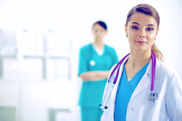 Woman doctor standing with stethoscope at hospital