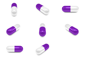Purple pills capsules isolated on white background.