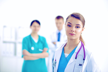 Fototapeta premium Woman doctor standing with stethoscope at hospital