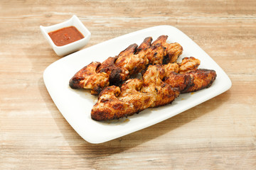 Plate of delicious barbecue chicken wings