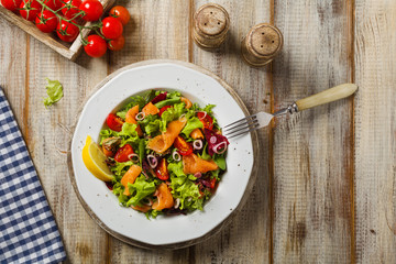 Fresh salad with smoked salmon.
