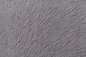Fototapeta premium Light gray background from soft textile material. Fabric with natural texture.