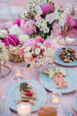 Table setting at a luxury wedding decorated with composition of