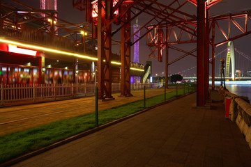 Empty road and iron tower with city landmark architecture backgr