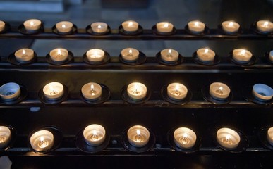 Candles lit in catholic temple