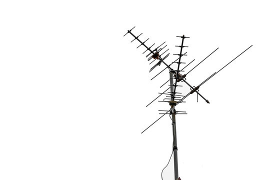 TV and communication aerials on roof of residential house, isolated antennas and dish