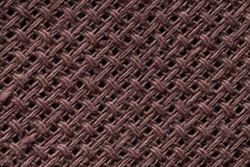 Naklejka premium Brown textile background closeup. Structure of the fabric macro.