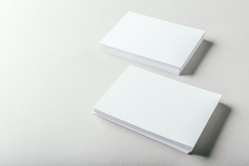 blank business cards on grey background
