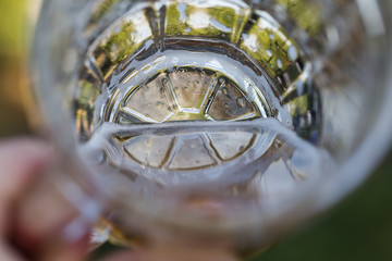 A glass of cold beer outdoors.
