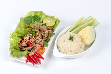 Sticky rice with spicy sour mixed herb salad of chicken and liver pork . Side view.