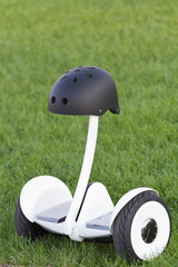 Obraz premium Black safety helmet on the segway