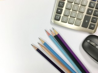 Calculator and pencil on desk table.