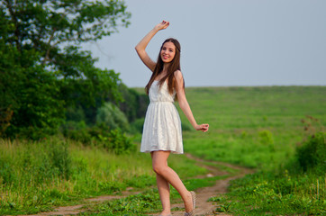 girl in white dress in field