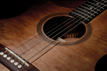 Fototapeta premium Close-up shot of mahogany guitar's features and sound hole