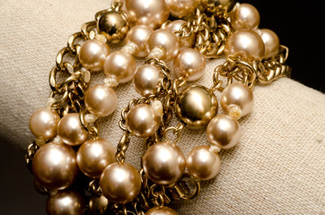 Golden pearls with golden chain links bracelet