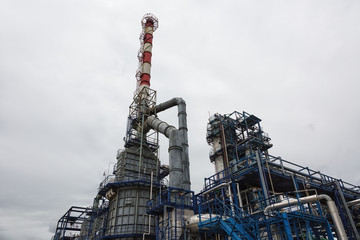 Chemical plant of a factory. Smokestacks ,pipes and tank