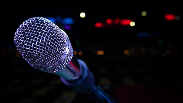 microphone stand on the stage venue with blur bokeh background