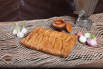 Pie on the table with food set