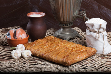 Pie on the table with food set