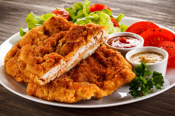Fried pork chops and vegetable salad 