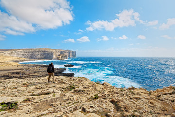 On the cliff of Dwejra Bay in Gozo, Malta