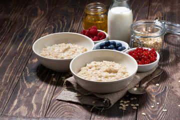 homemade oatmeal and berries on wooden background