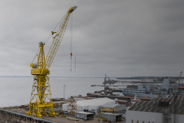 Fototapeta na wymiar Yellow crane at the docks