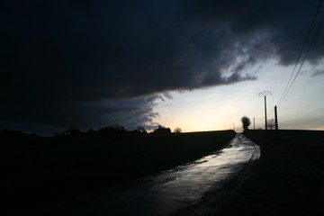 brooding landscape of a small town in France in late evening after a storm
