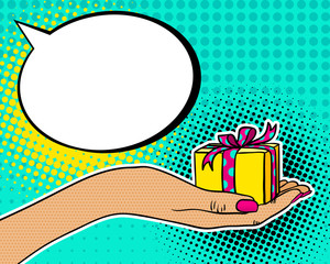 Pop art background with female hand holding a gift and speech bubble. Vector hand drawn illustration in retro comic style.
