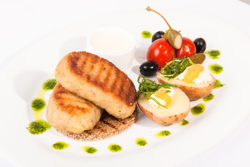 Pike cutlets with garnish