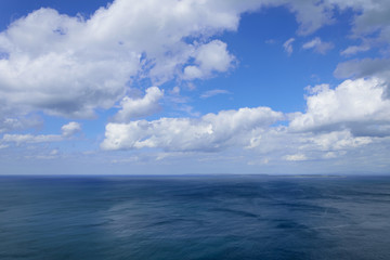 Naklejka na ściany i meble Atlantic ocean and blue cloudy sky, Aran islands