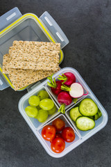 Tasty vegetarian food in plastic lunch box. Bento box. Take away food. 