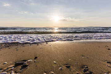 Sunrise on the beach, Rafina town, Greece