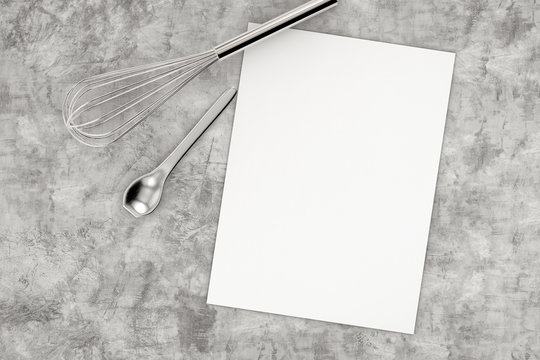 blank paper with kitchen utensils top view