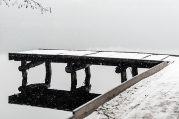  Snow footbridge in to the lake in winter time