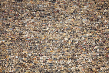 Old large weathered distressed Norman medieval stone wall background