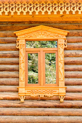 Detail of a window of a traditional wood log house in Vladimir, Golden ring,  Russia