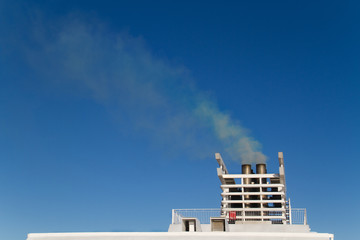 Exhaust gas from the smokestack of a ship