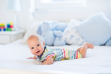 Baby boy in bed