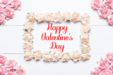 Happy Valentine's Day concept. White frame made of roses