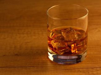 Glass of scotch whiskey and ice