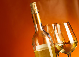 White wine bottle and two glasses with white wine