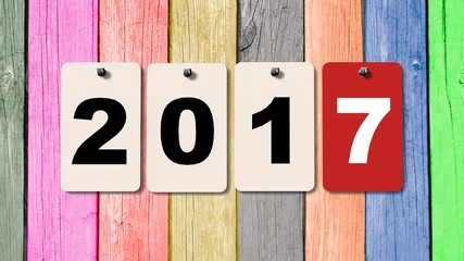 2017 calendar plates on wooden wall, represents the new year 2017