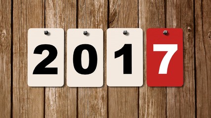 2017 calendar plates on wooden wall, represents the new year 2017