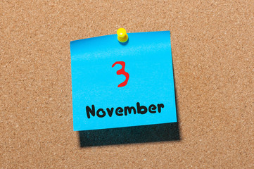 November 3rd. Day 3 of month, color sticker calendar on notice board. Autumn time. Empty space for text