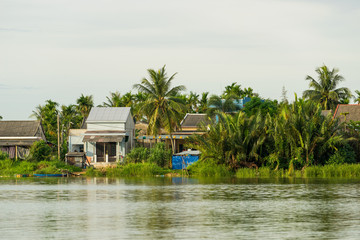 Fototapeta premium Houses along the Thu Bon river near Hoi An