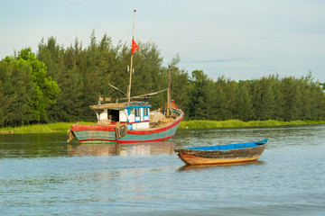 Floating boats on Thu Bon river near ancient Hoi An