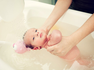 Fototapeta na wymiar Newborn first bath