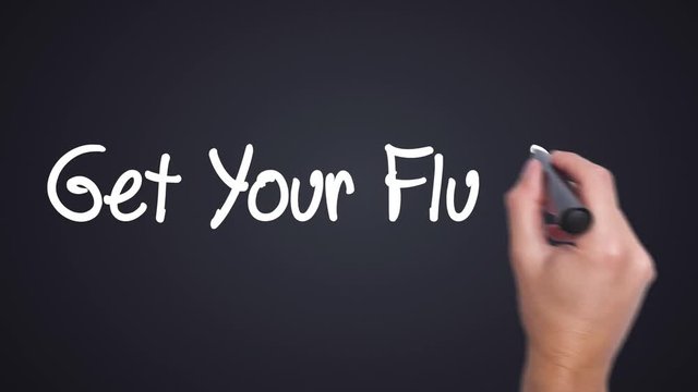 Get Your Flu Shot - Man Hand writing with marker. Business, internet, technology concept. Sign on the background. Big dreams, hopes and aspirations. 4k