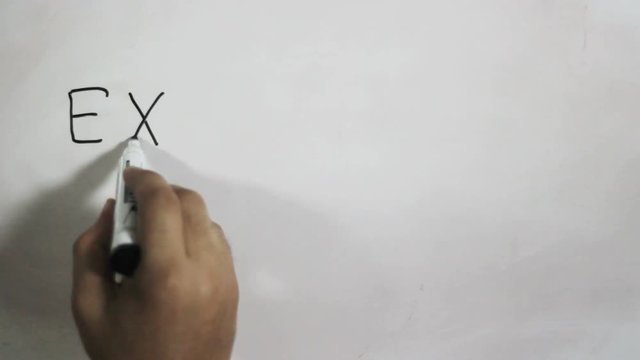 Hand writing a "exercise everywhere" message on a white board using a black marker
